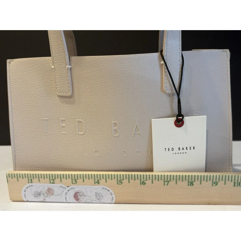 Ted Baker Icon small tote bag in a cream-colored, structured material.